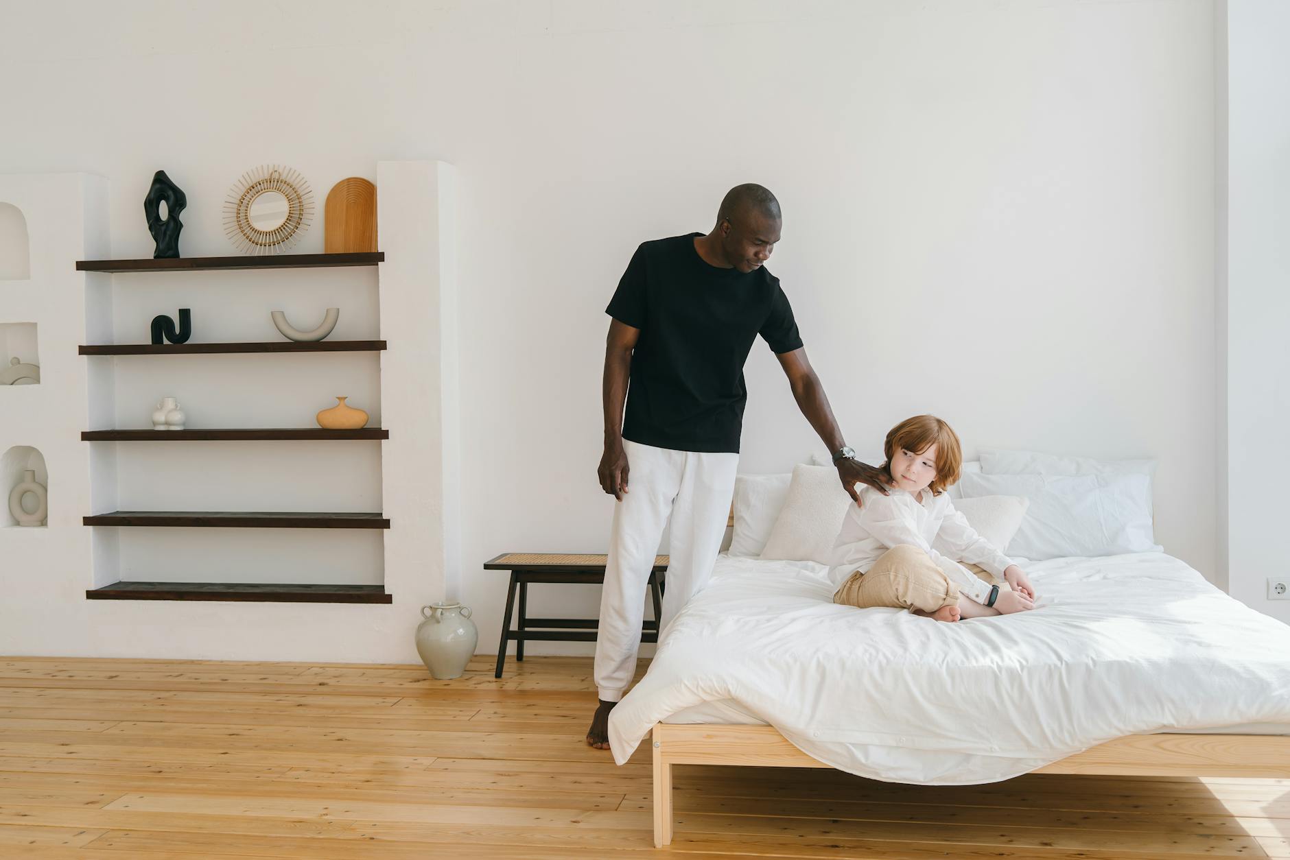 boy sitting on the bed